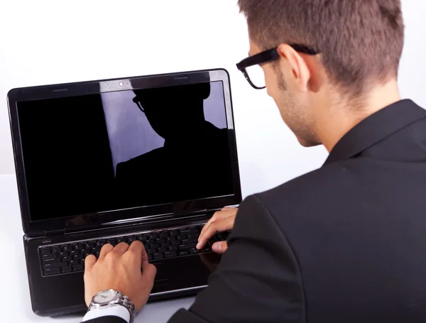 Back view of a business man working at laptop — Stock Photo, Image