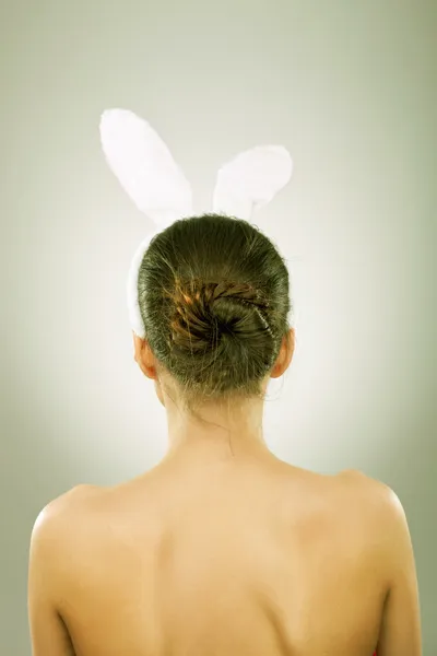 Back of a woman with bunny ears — Stock Photo, Image