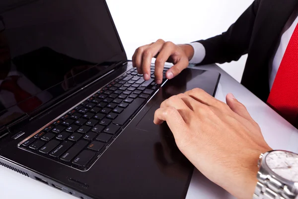 typing male business man's hands on laptop