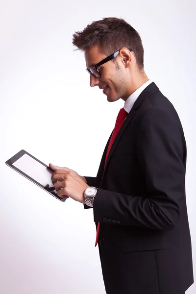 Business man browsing on his touch screen pad — Stock Photo, Image