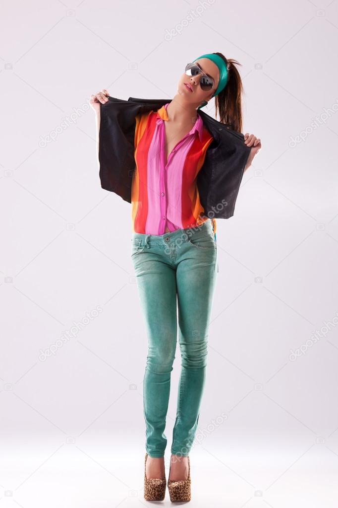 casual woman taking off her jacket