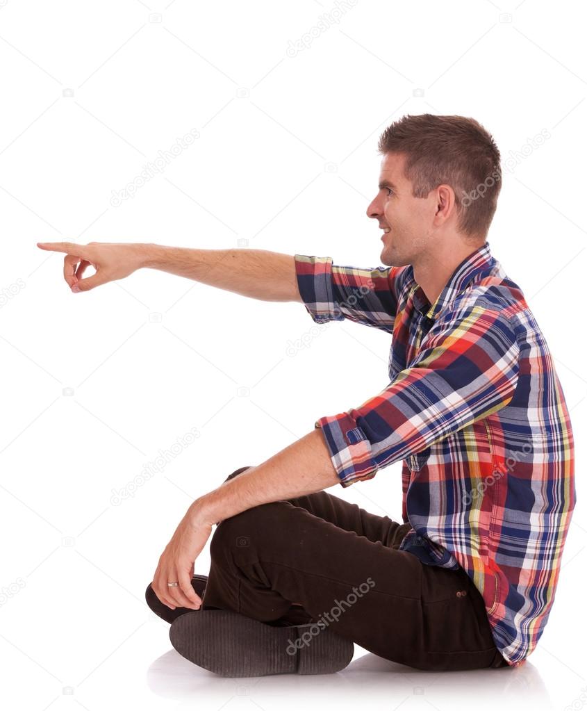 man sitting cross legged side view