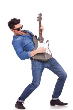 young guitarist performing clipart