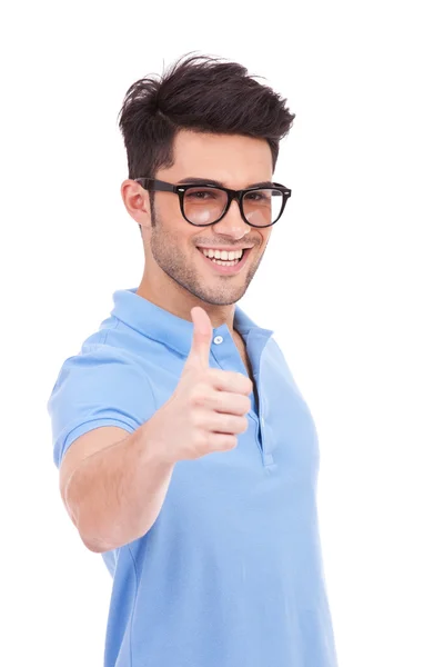 Young man holding thumbs up — Stock Photo, Image