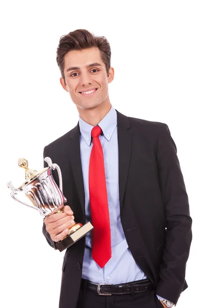 Homem de negócios vencedor segurando um troféu copo — Fotografia de Stock