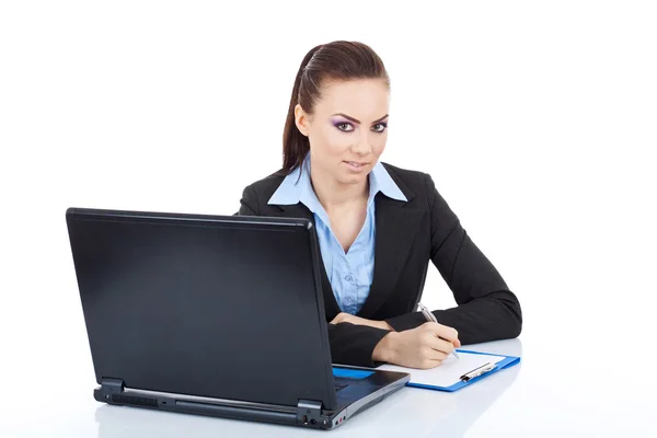 Woman with laptop and pen Royalty Free Stock Images