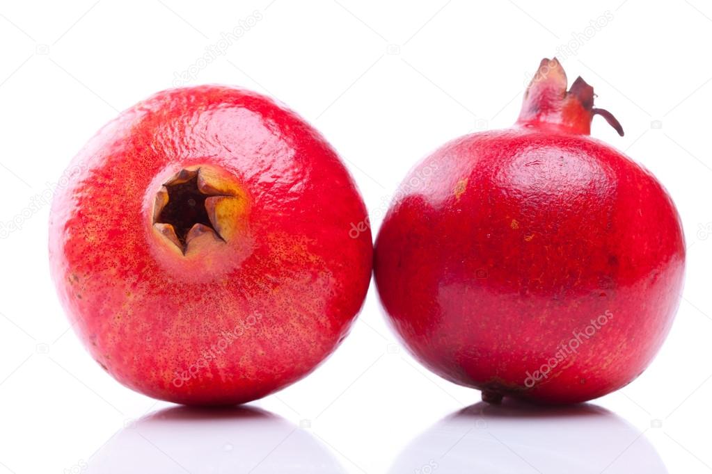 two fresh pomegranates