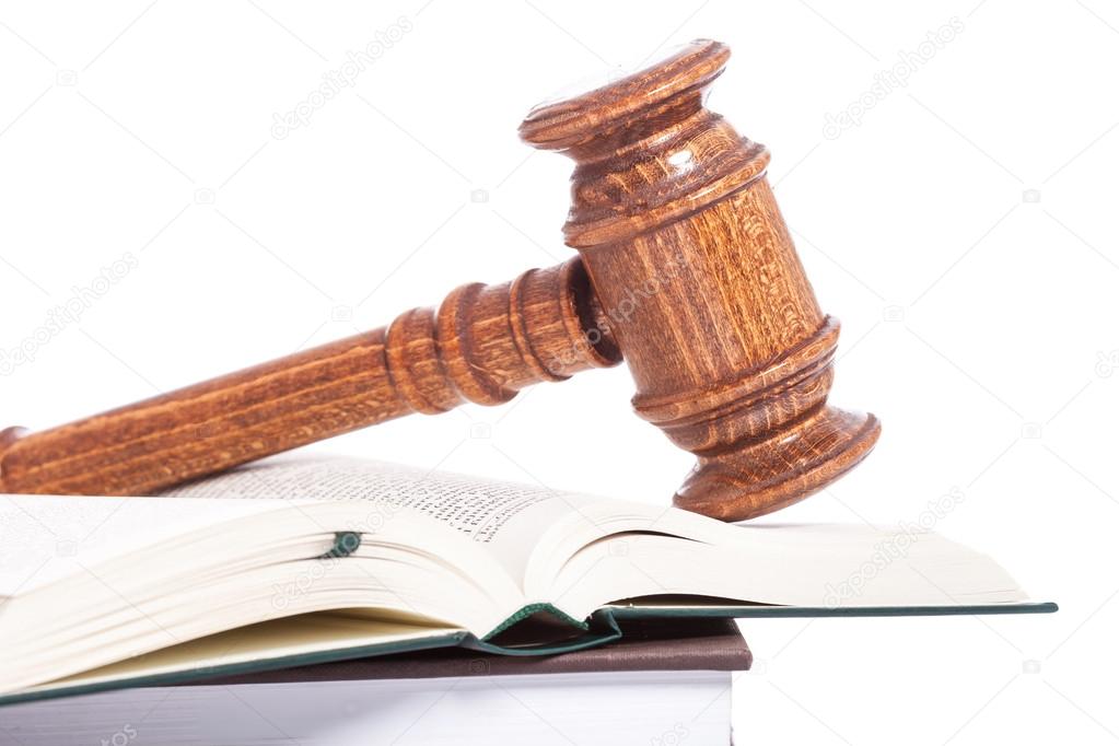 wooden judge gavel on a book