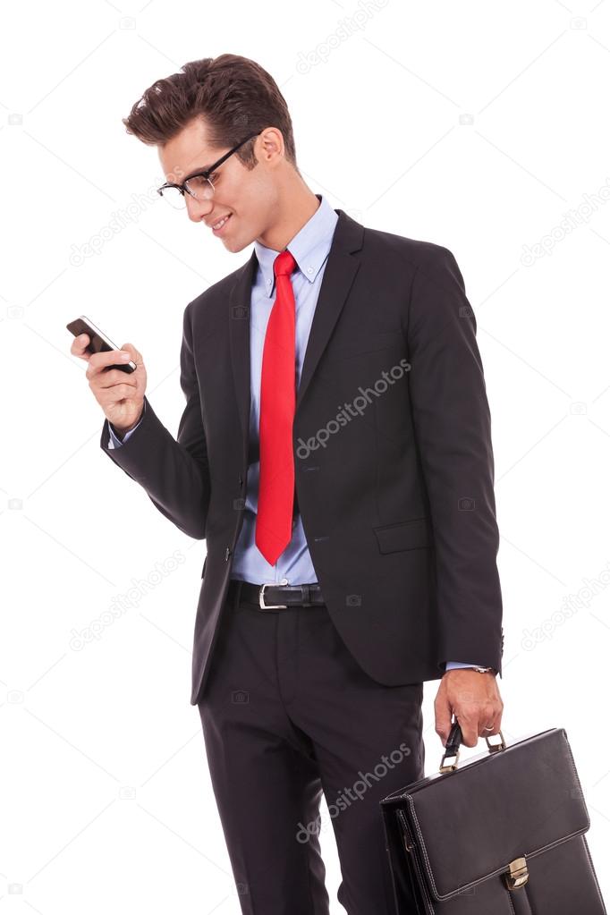 Business man reading an SMS on smartphone