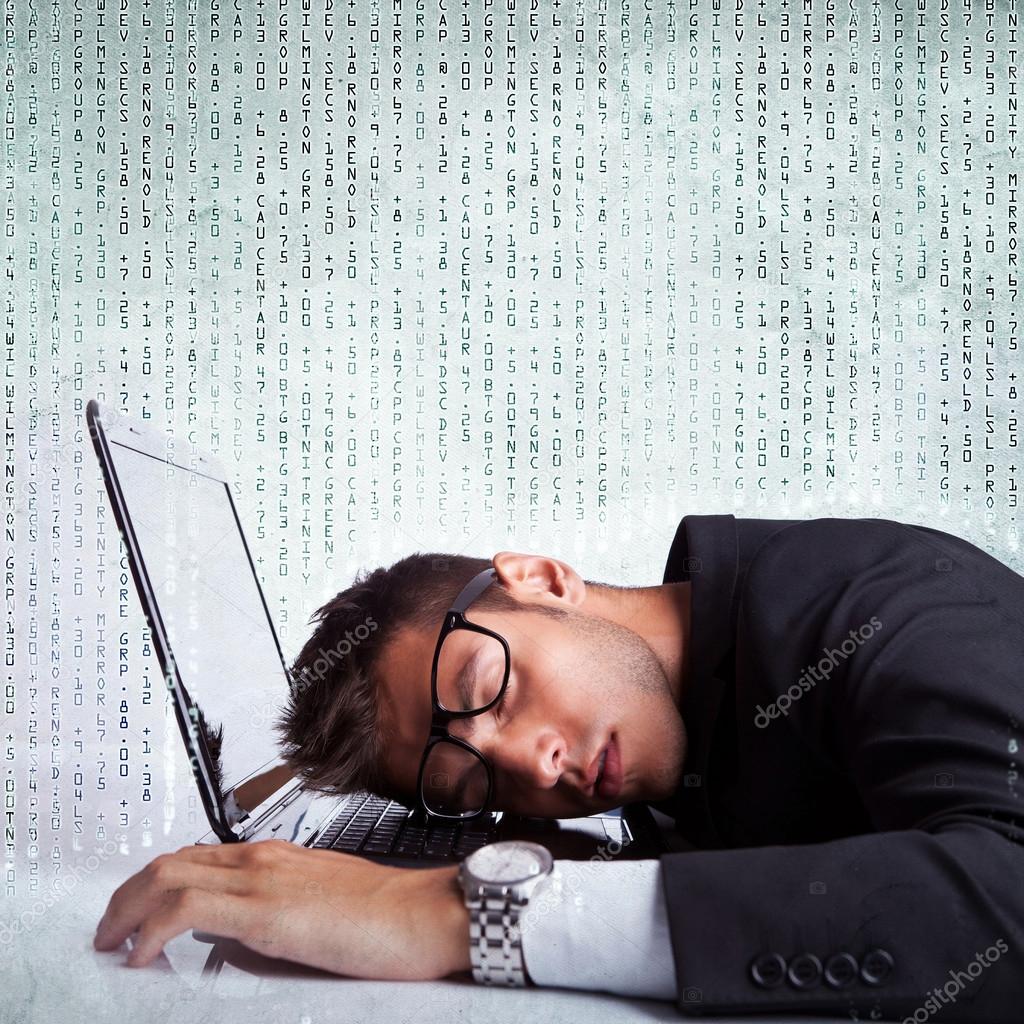 Business man sleeping on a laptop computer