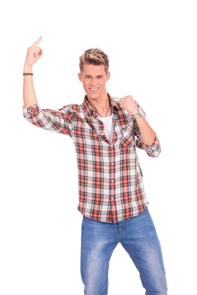 Casual young man pointing up — Stock Photo, Image