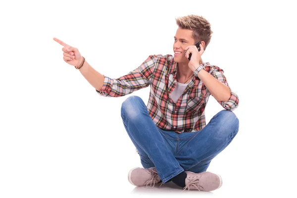 Man sitting and pointing — Stock Photo, Image