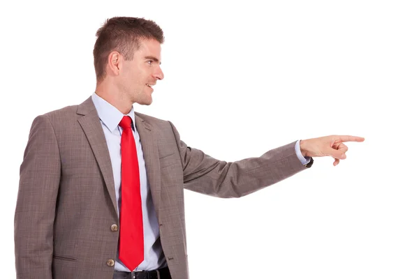 Business man pointing to his side — Stock Photo, Image