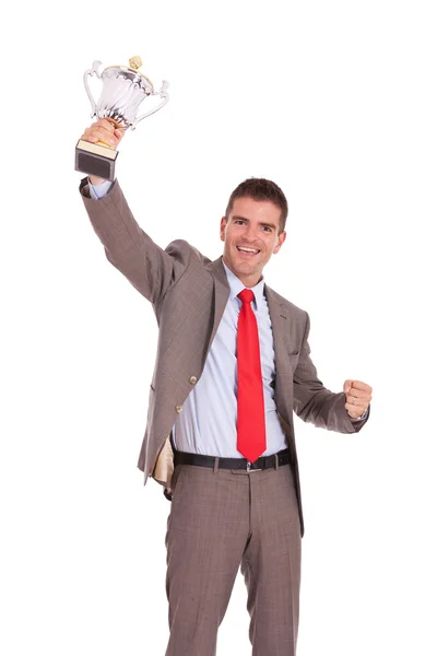 Business man raising trophy — Stock Photo, Image