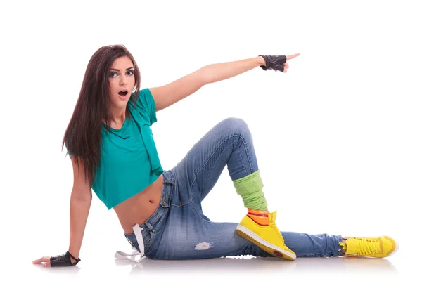 Street dancer on the floor pointing — Stock Photo, Image