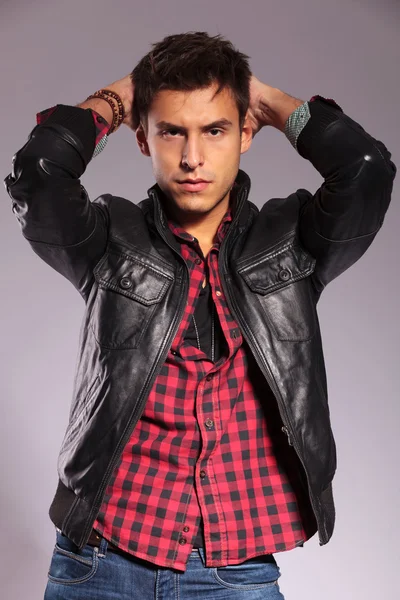 Casual man in leather jacket in a fashion pose — Stock Photo, Image