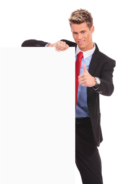 Business man with blank board making ok