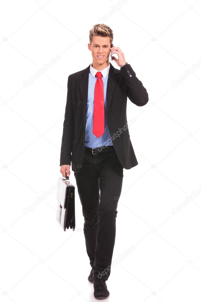 Business man with suitcase walking