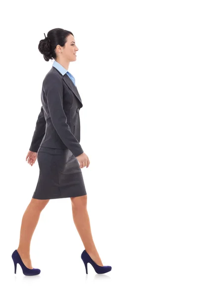 Side view of a business woman walking — Stockfoto