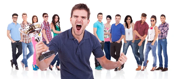 Casual man winning a trophy and screaming — Stock Photo, Image