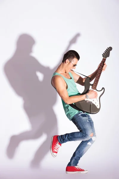 Model rocking on an electric guitar Royalty Free Stock Images