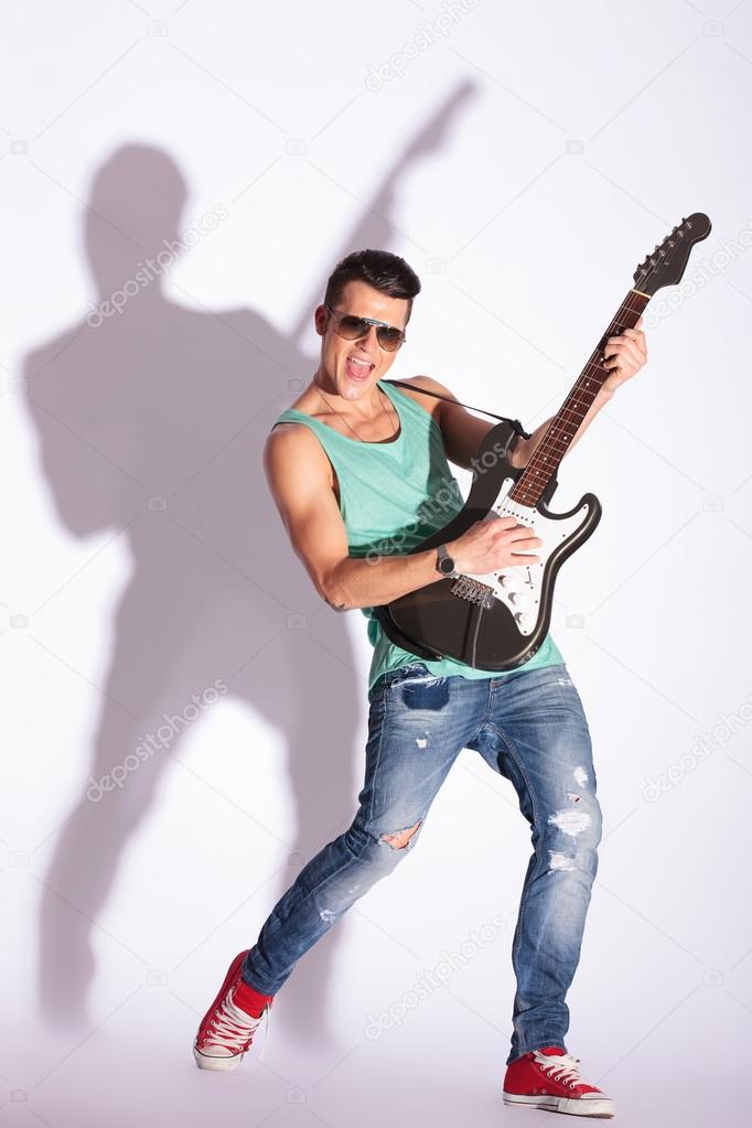 model rocking on a guitar