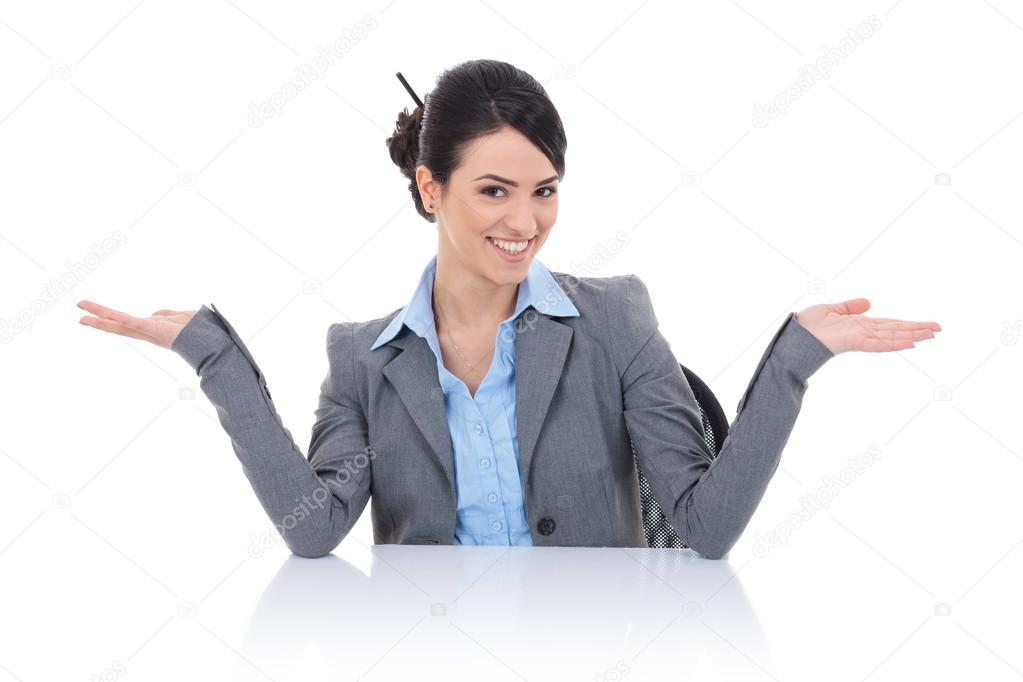business woman sitting behind desk and welcomming