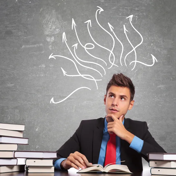 Thoughtful business man reading a book — Stock Photo, Image