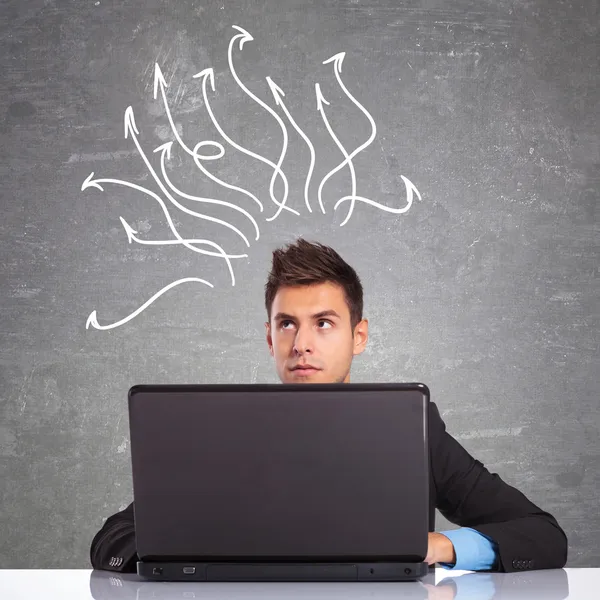 Business man using laptop thinking — Stock Photo, Image