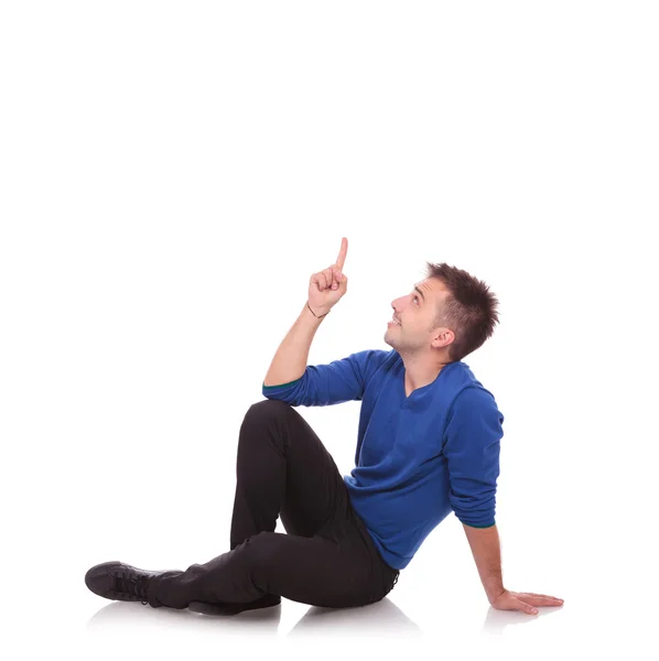 Young casual man pointing up — Stock Photo, Image