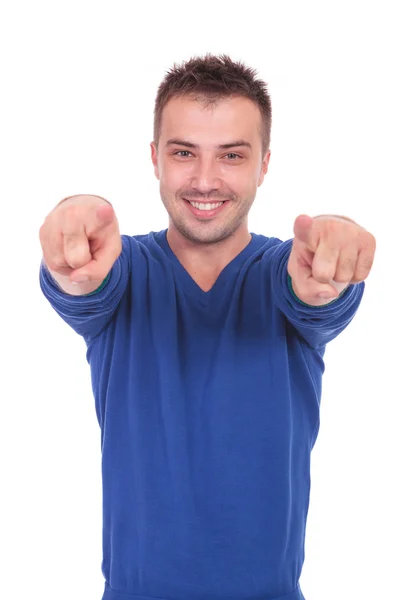 Young man pointing with his fingers Royalty Free Stock Photos
