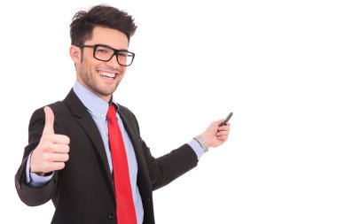 business man shows thumbs up & points