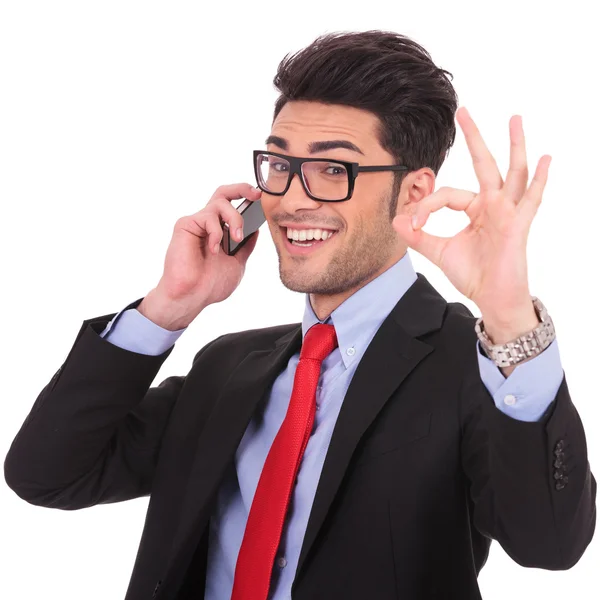 Business man shows ok sign on phone — Stock Photo, Image