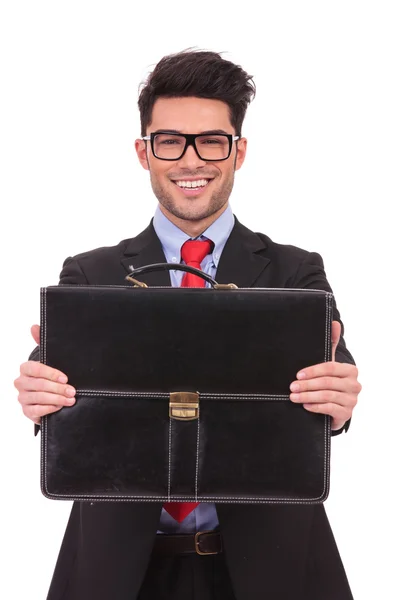 Business man presents briefcase — Stock Photo, Image