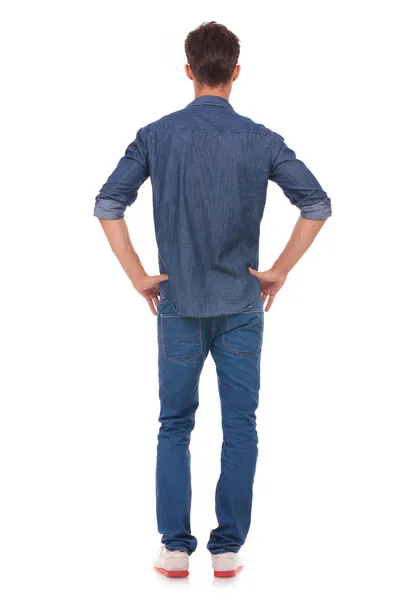 Man with hands on hips from back — Stock Photo, Image