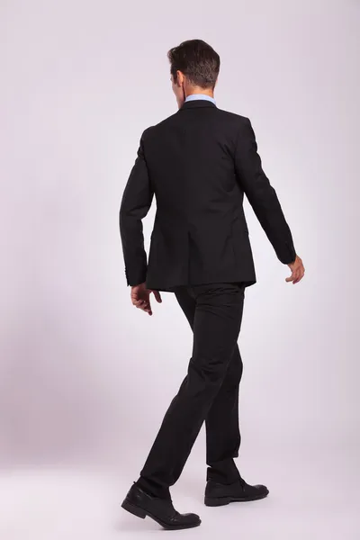 Back view of business man walking — Stock Photo, Image