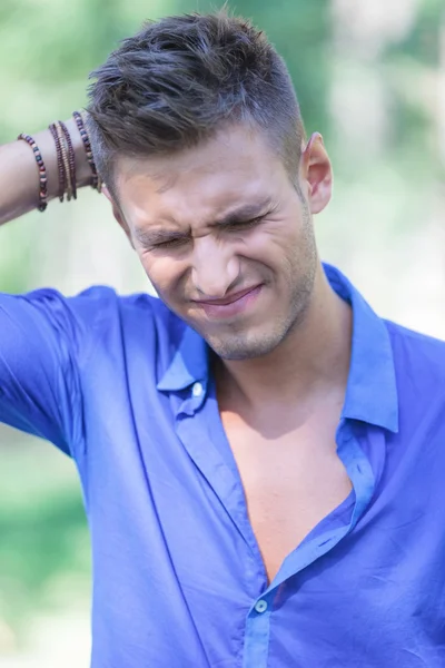 Worried young man outdoors — Stock Photo, Image