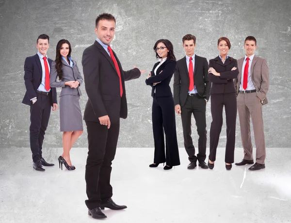 Business team being presented by a young leader — Stock Photo, Image