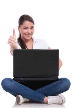 Casual woman sits with laptop & ok clipart