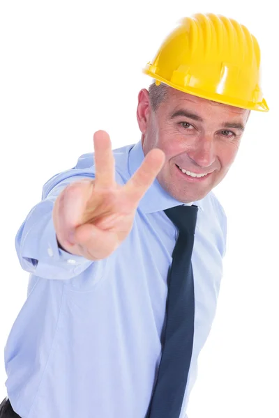 Old engineer shows victory sign — Stock Photo, Image