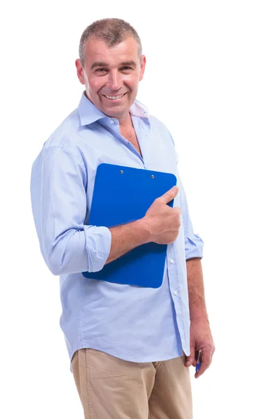 Příležitostné středního věku muž s schránky — Stock fotografie