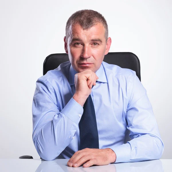 Portrait of an old business man at desk Stock Photo