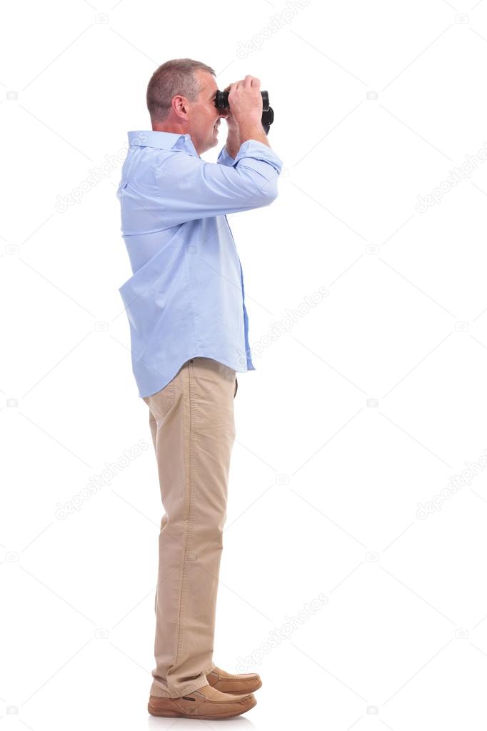 casual middle aged man with binoculars