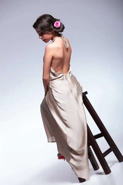 Back view of beauty woman on chair — Stock Photo, Image