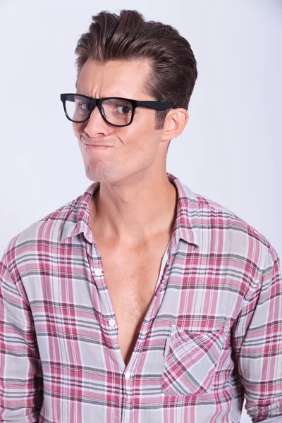 casual man looks with doubt — 图库照片