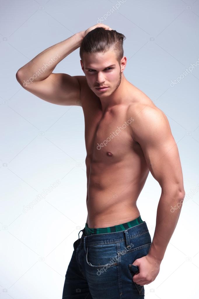 side view of a topless young man