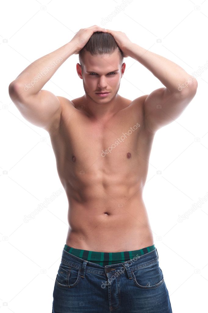 topless fashion man holds hair with both hands