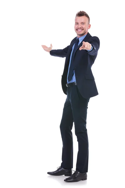 Business man presents and points at you — Stock Photo, Image