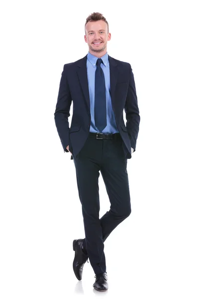 Business man stands with both hands in pockets — Stock Photo, Image