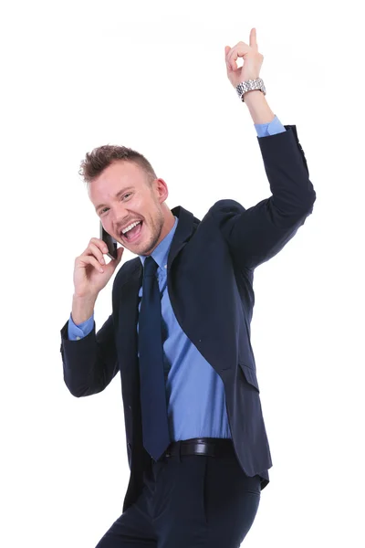 Business man cheers while on phone — Stock Photo, Image